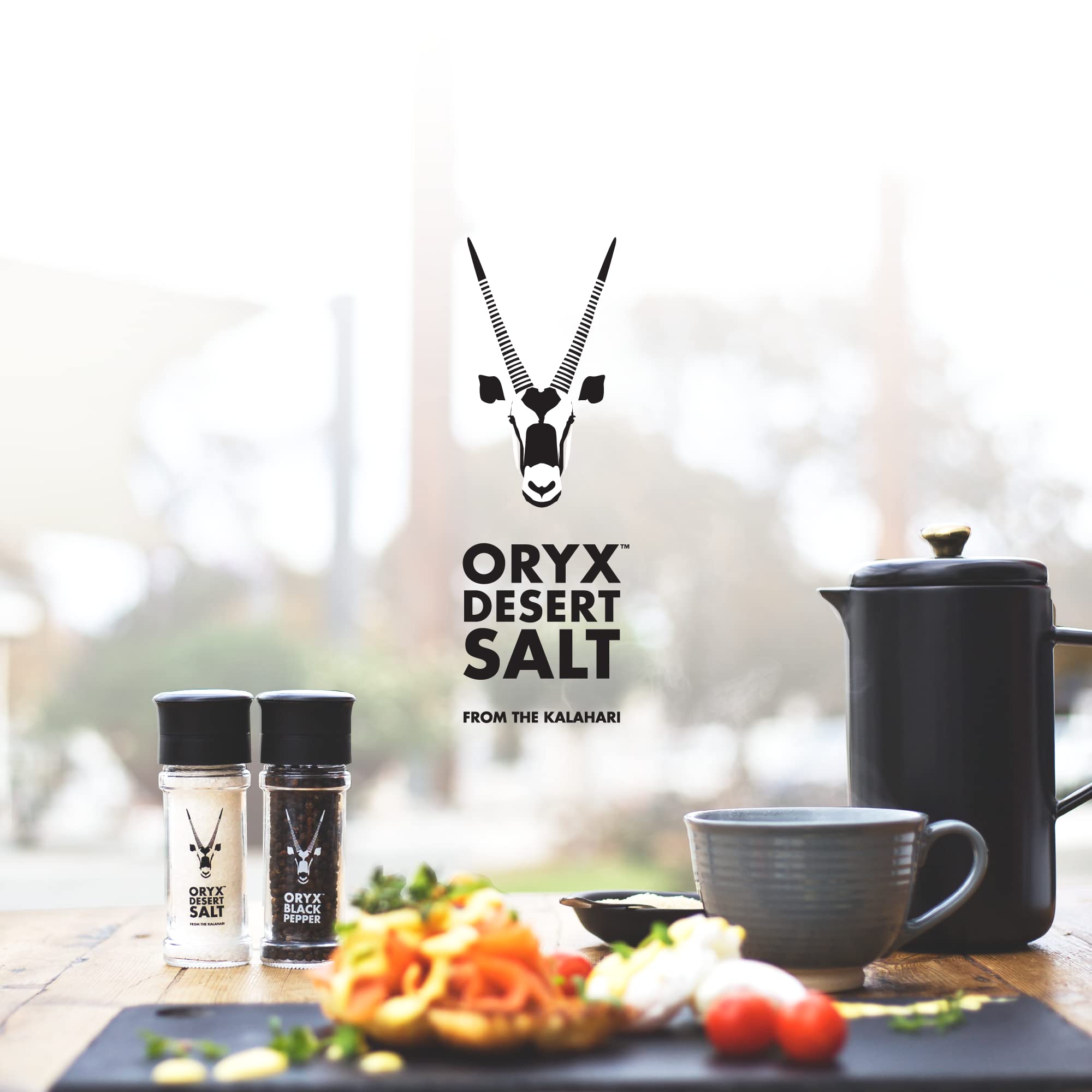 Oryx Black Pepper Grinder on dining table, ideal for preparing gourmet meals.