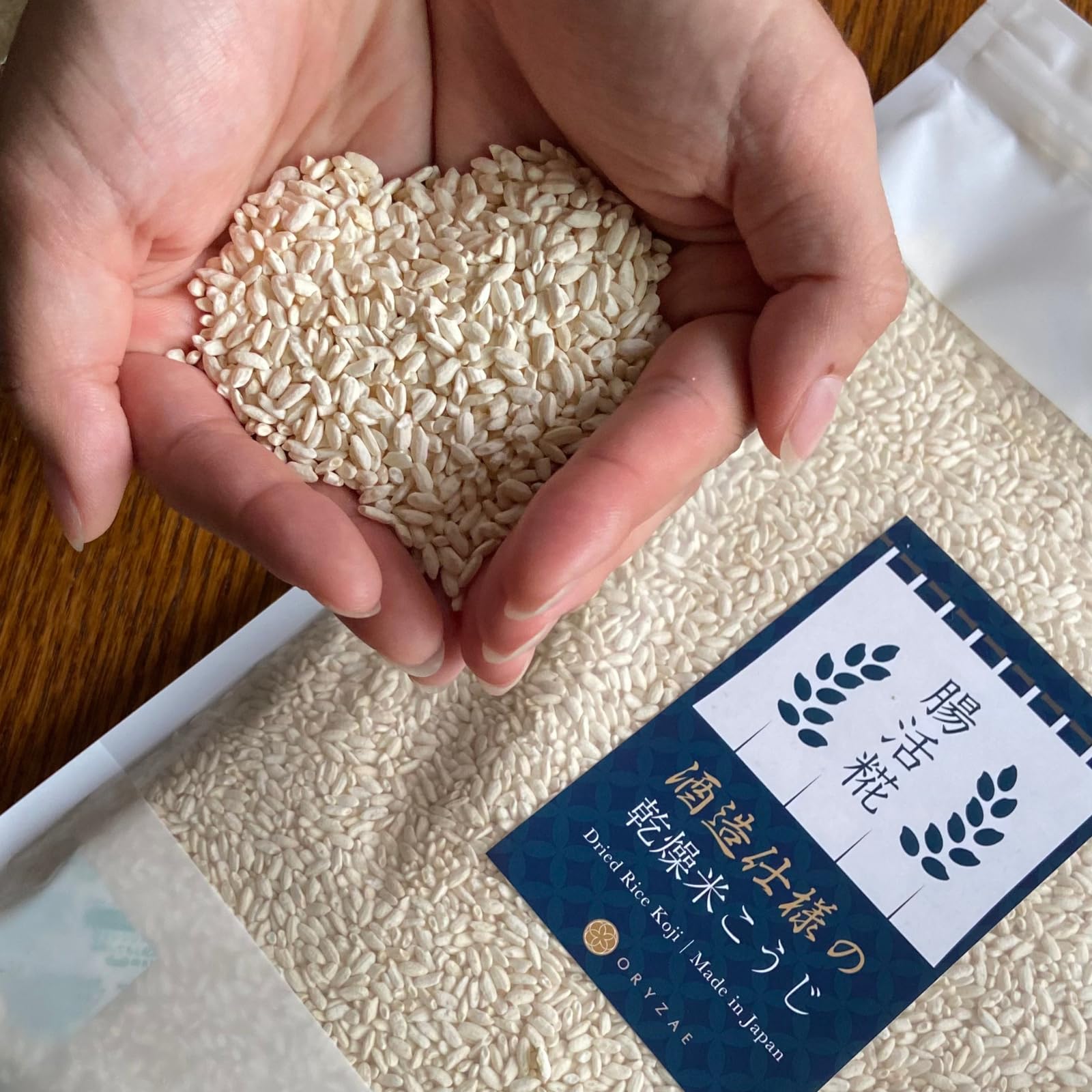 Close-up of ORYZAE dried rice koji grains for koji-based seasoning.