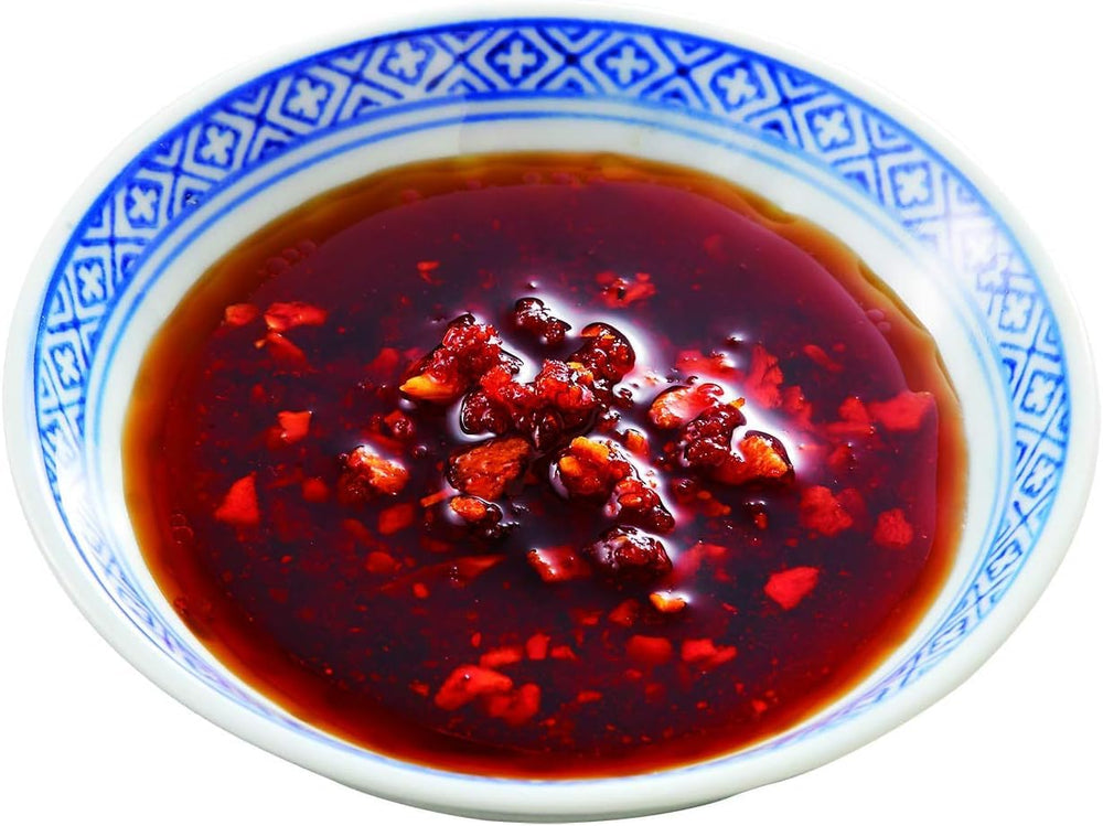 OSK S&B chili oil with crunchy garlic topping on tofu for a savory finish