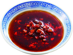 OSK S&B chili oil with crunchy garlic topping on tofu for a savory finish