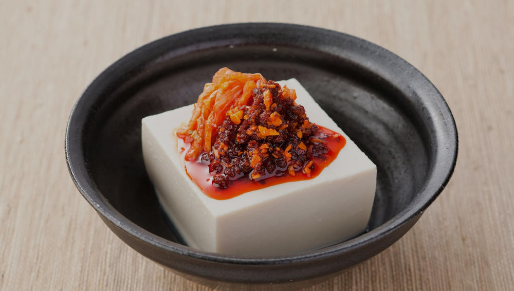 OSK S&B chili oil with crunchy garlic topping ready to drizzle on vegetables