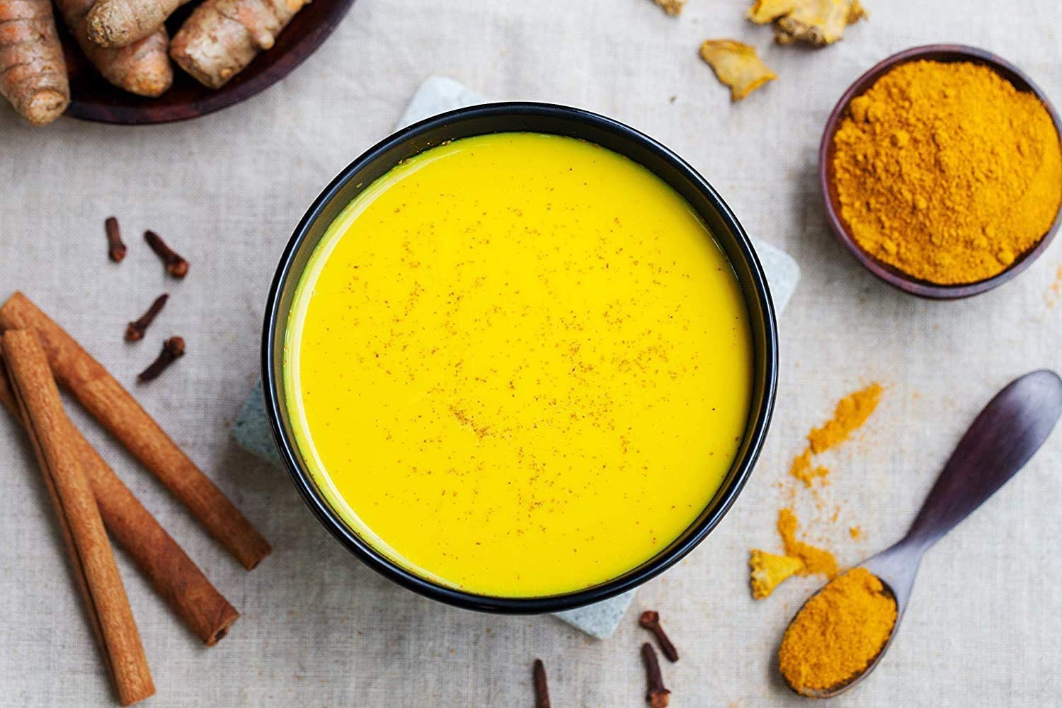 OSR Golden turmeric powder in a bowl adds aroma and color to recipes.