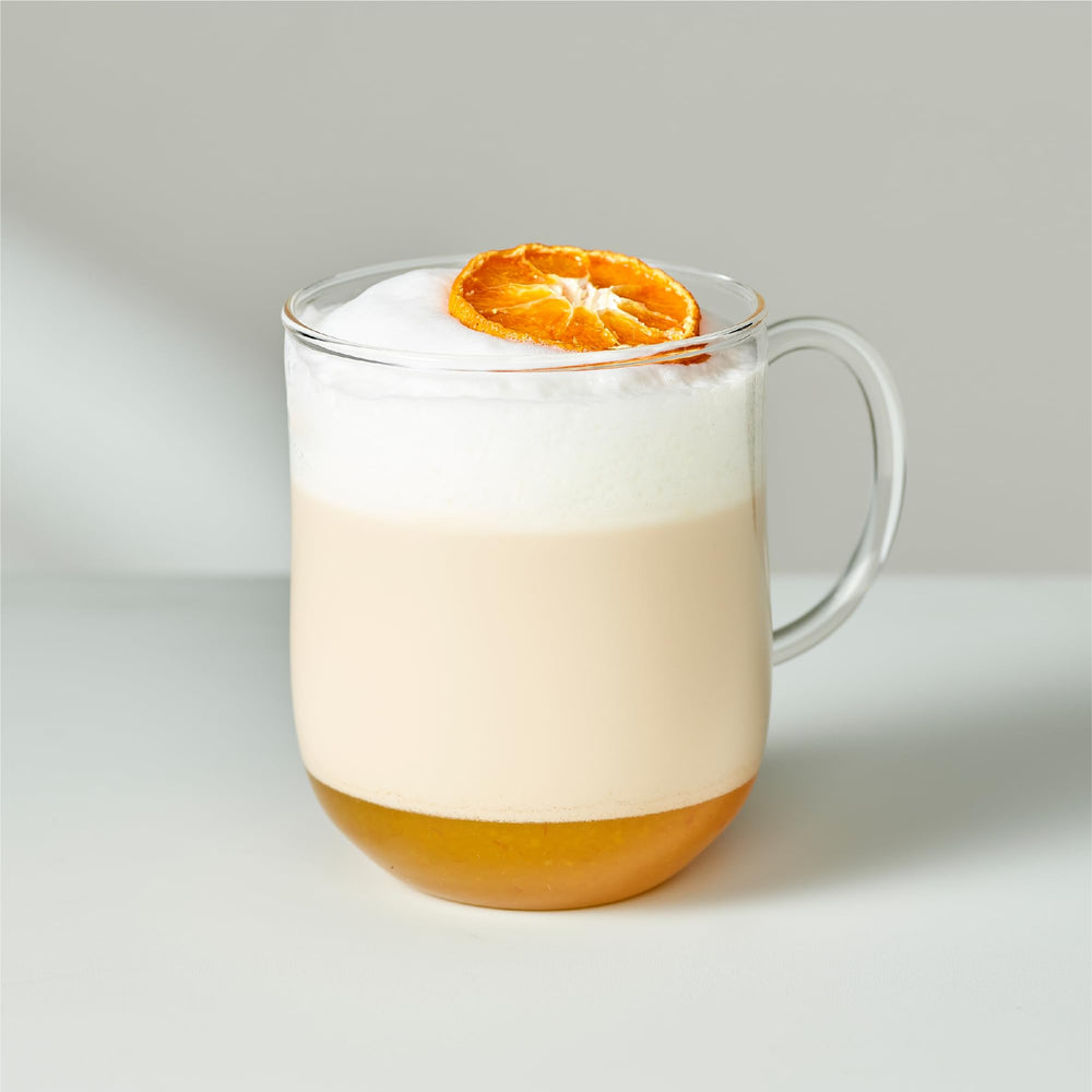 Prepared Osulloc Tangerine Tea iced in a tall glass for a refreshing moment.
