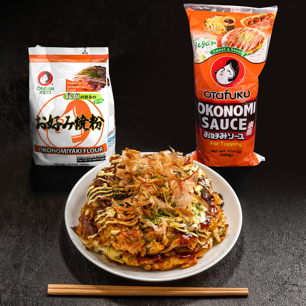 Okonomi sauce bottle next to vegan ingredients like carrots and apples.