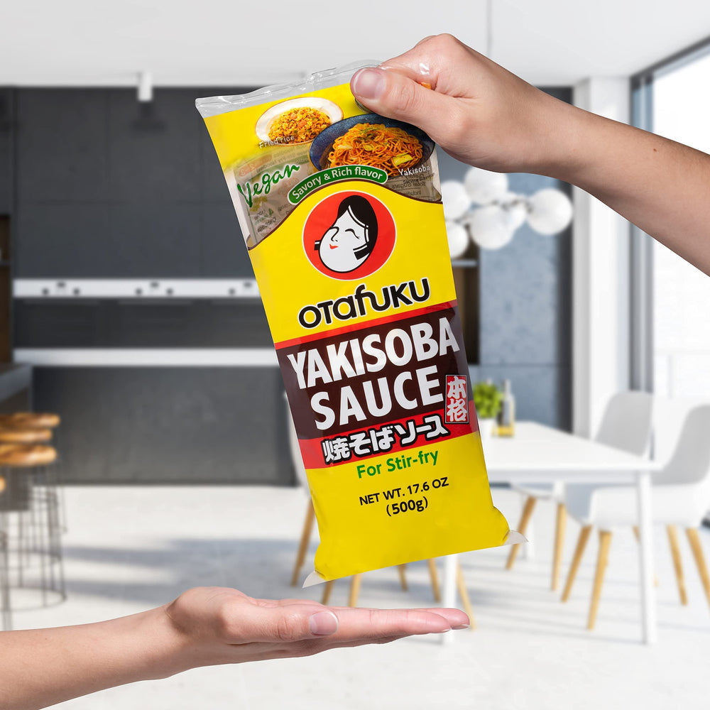 Otafuku Yakisoba Sauce ready-to-use glaze over sizzling vegetables and noodles.