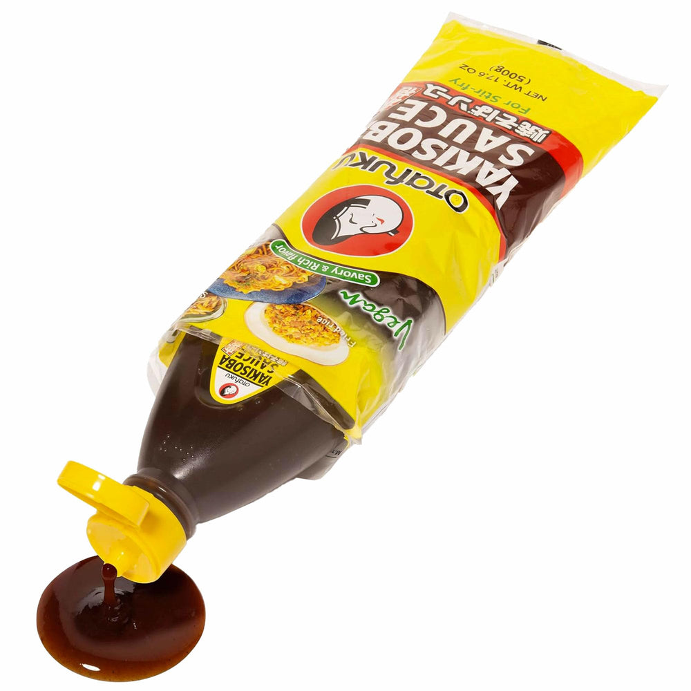 Otafuku Yakisoba Sauce vegan badge and bottle on kitchen counter.