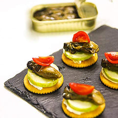 Otter Kingdom hand-packed smoked oysters demonstrate artisanal care and premium oil infusion.