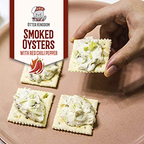 Otter Kingdom olives oil glaze on smoked oysters for silky texture.