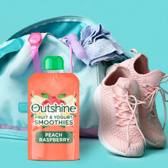 Kids enjoy an Outshine Raspberry Peach smoothie pouch as a snack.
