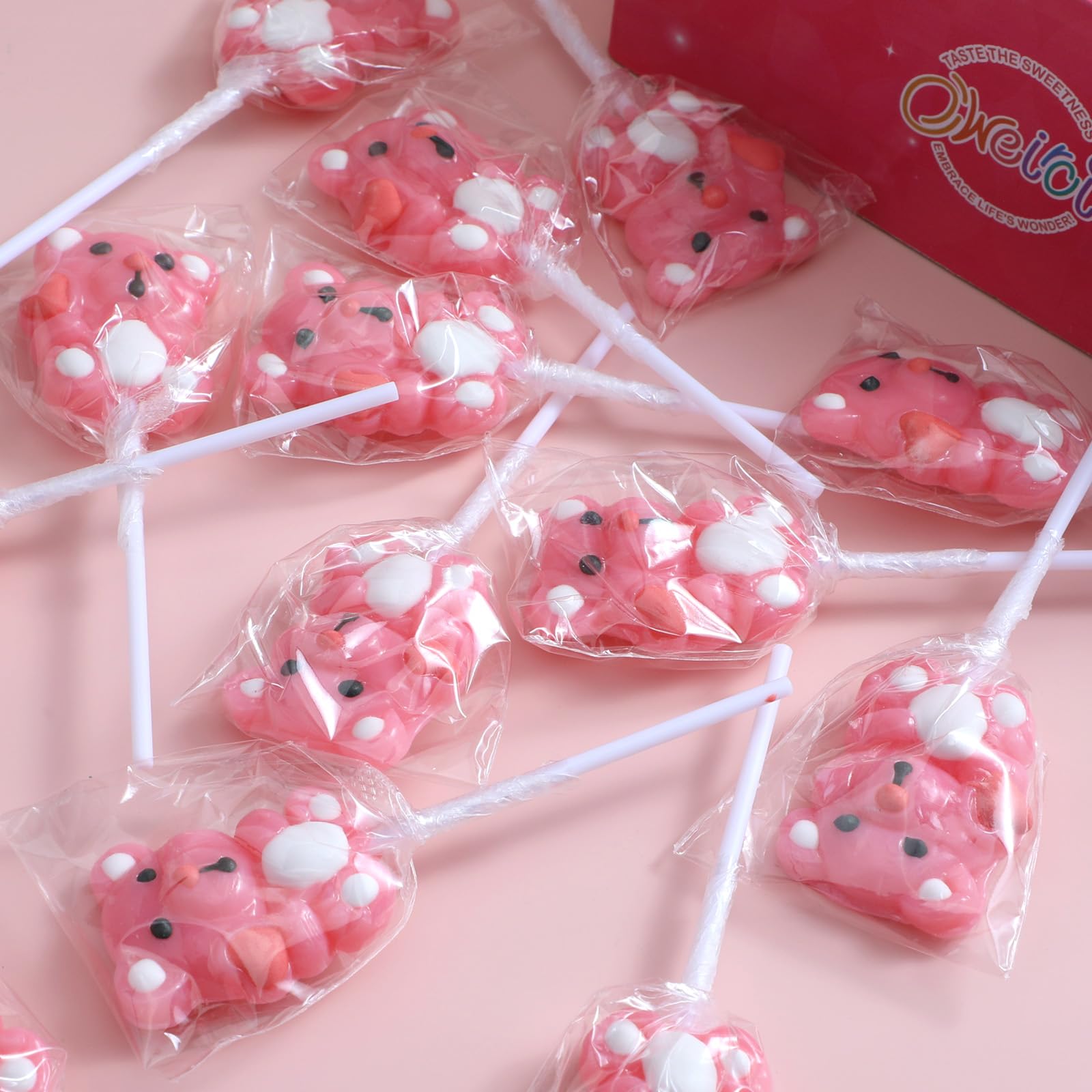 Oweiroi strawberry-flavored bear lollipop on display at a party table.
