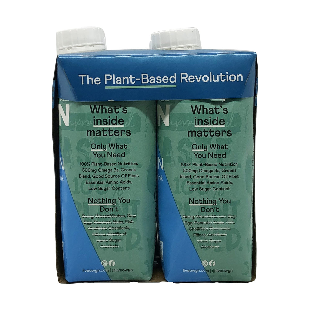 OWYN vanilla shake on a table with ingredients emphasizes quick plant protein.