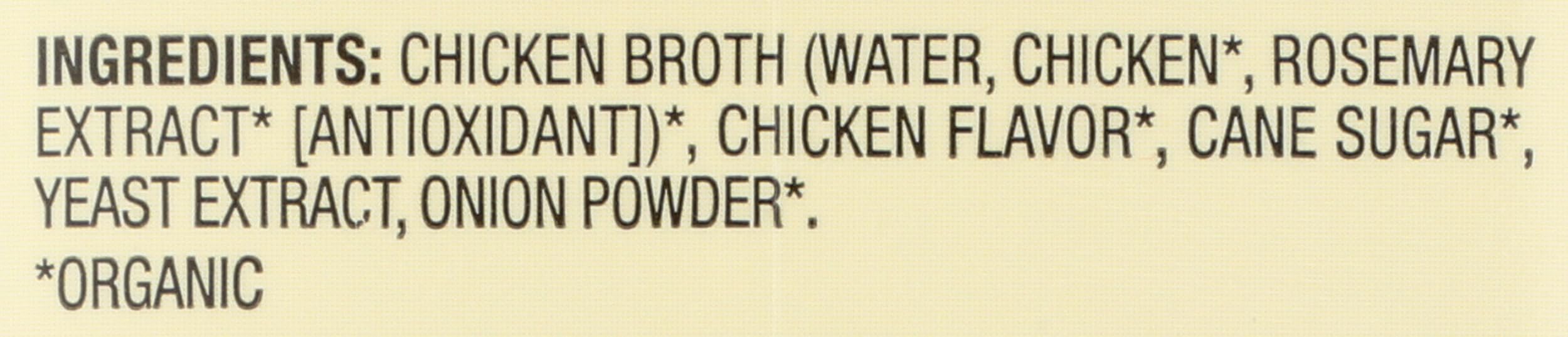 Pouring Pacific Foods chicken broth into a pot for base flavor