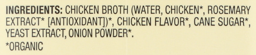 Pouring Pacific Foods chicken broth into a pot for base flavor