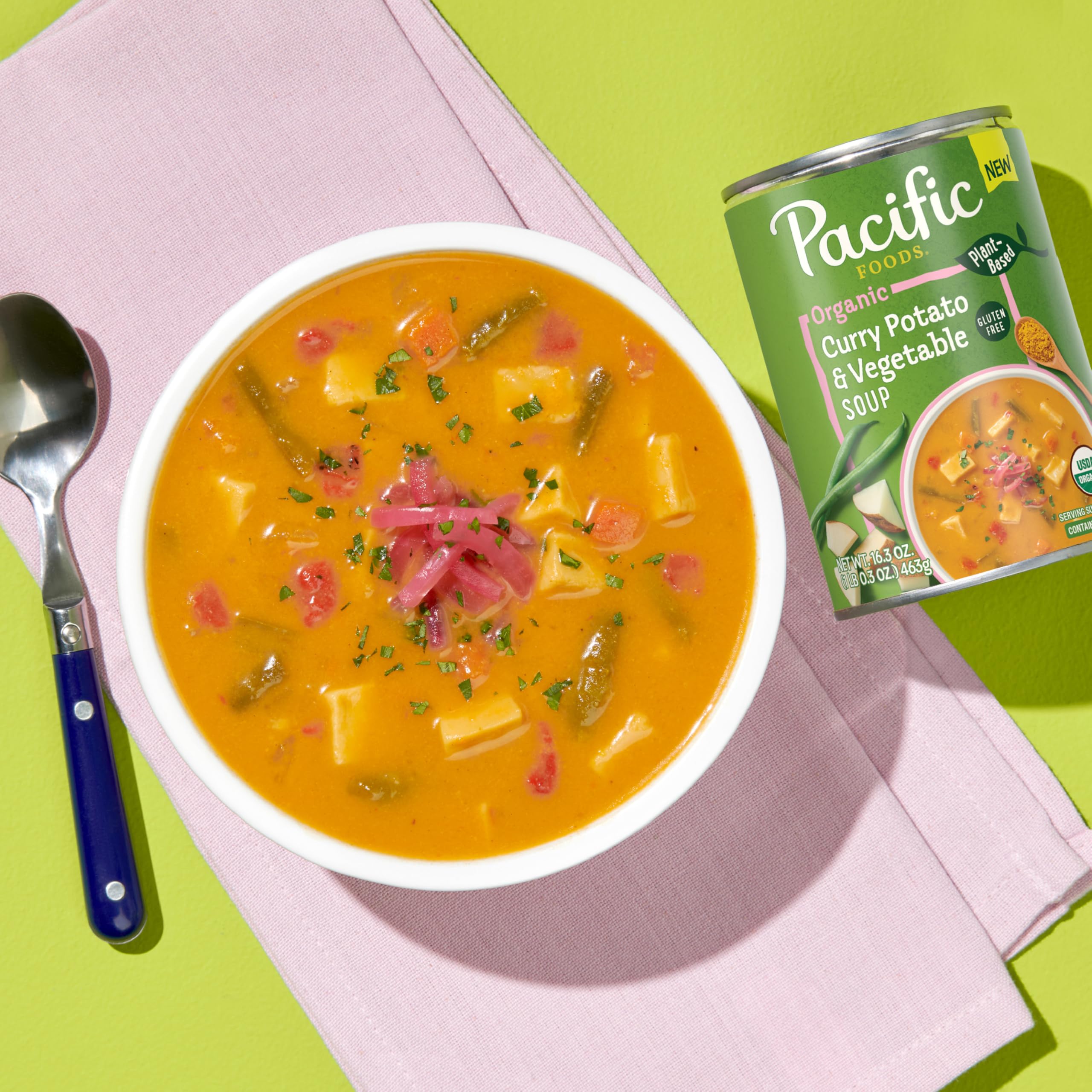 Pacific Foods Organic Curry Potato and Vegetable Soup being poured into a bowl for easy dinner.