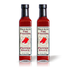Palo Alto Firefighters Pepper Sauce bottle on counter, salt-free flavor enhancer.