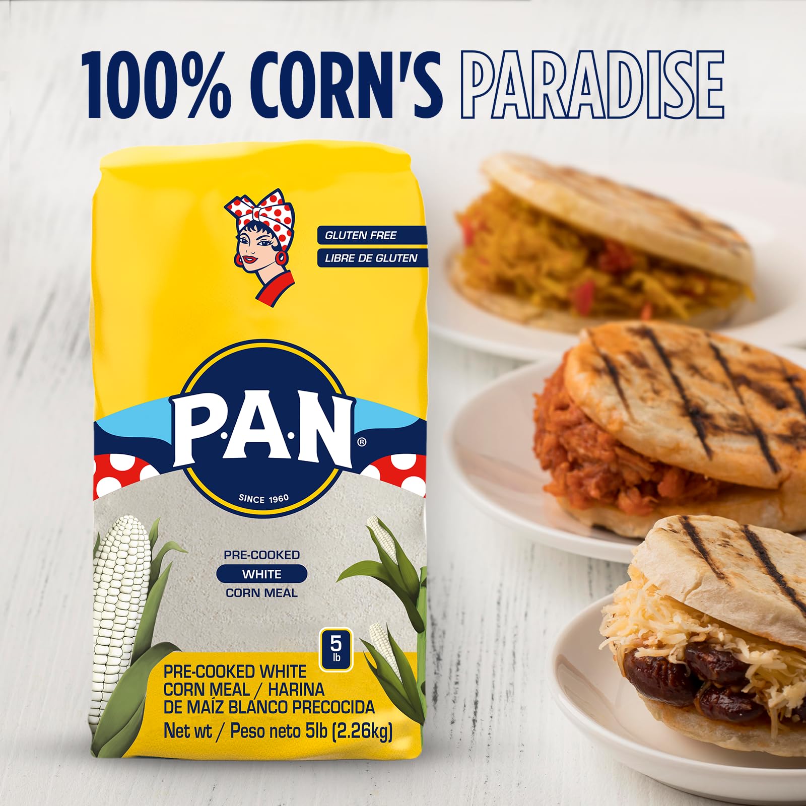 P.A.N. arepa cooking on a griddle to a golden brown crust.