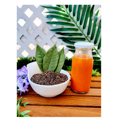 Pantai Norasingh Thai tea poured over ice with condensed milk for a creamy drink.
