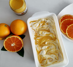 Spoonful of orange curd ready to fill cakes or pastries.