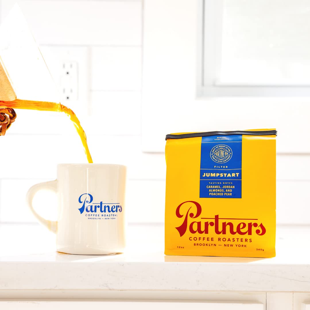 PARTNERS COFFEE ROASTERS Jumpstart bag art and beans invite ready-to-grind convenience.
