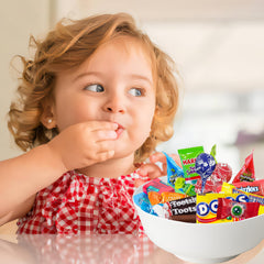 Partypom gummy snakes and eyeball candy add playful bowls.