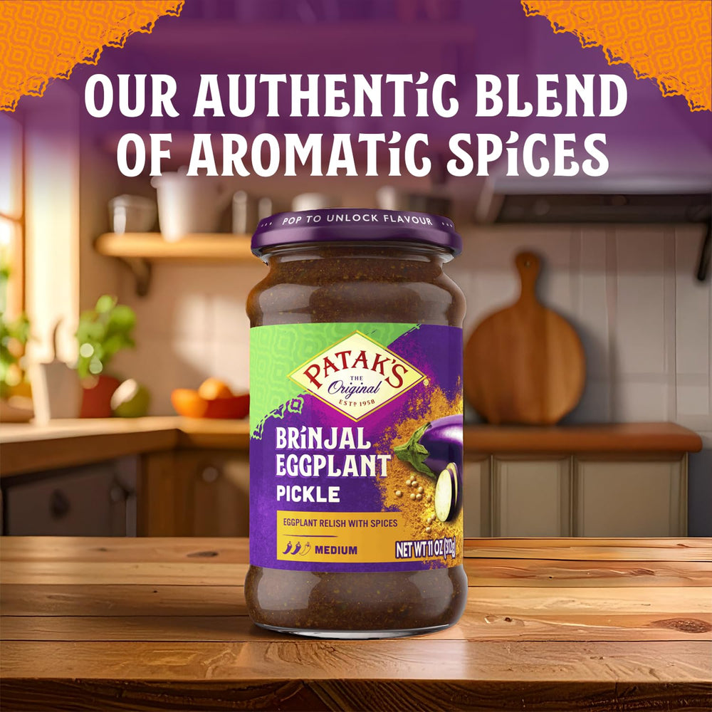 Patak's Brinjal Eggplant Pickle garlic slices with herbs for aroma.