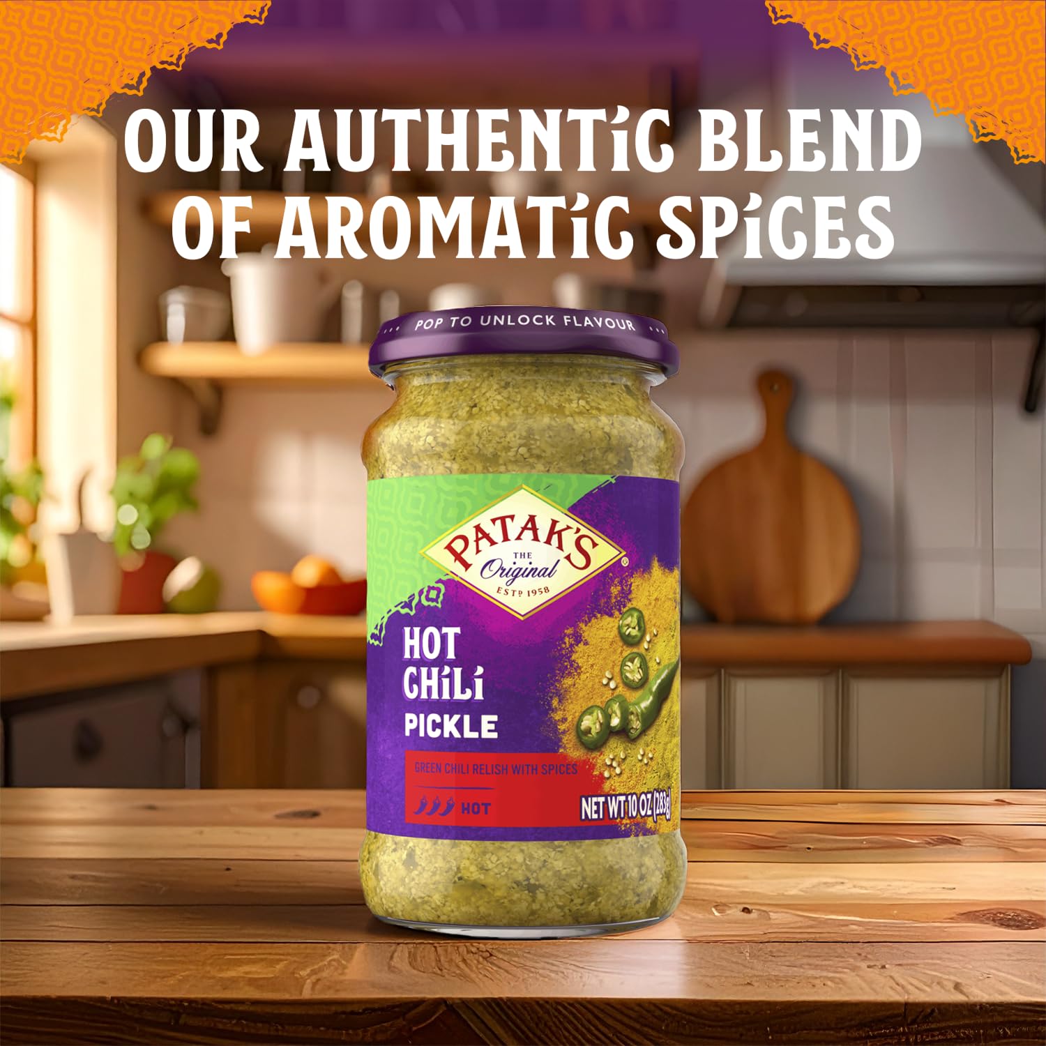 Patak's Hot Chile Pickle spoon dipping close-up for tangy flavor.