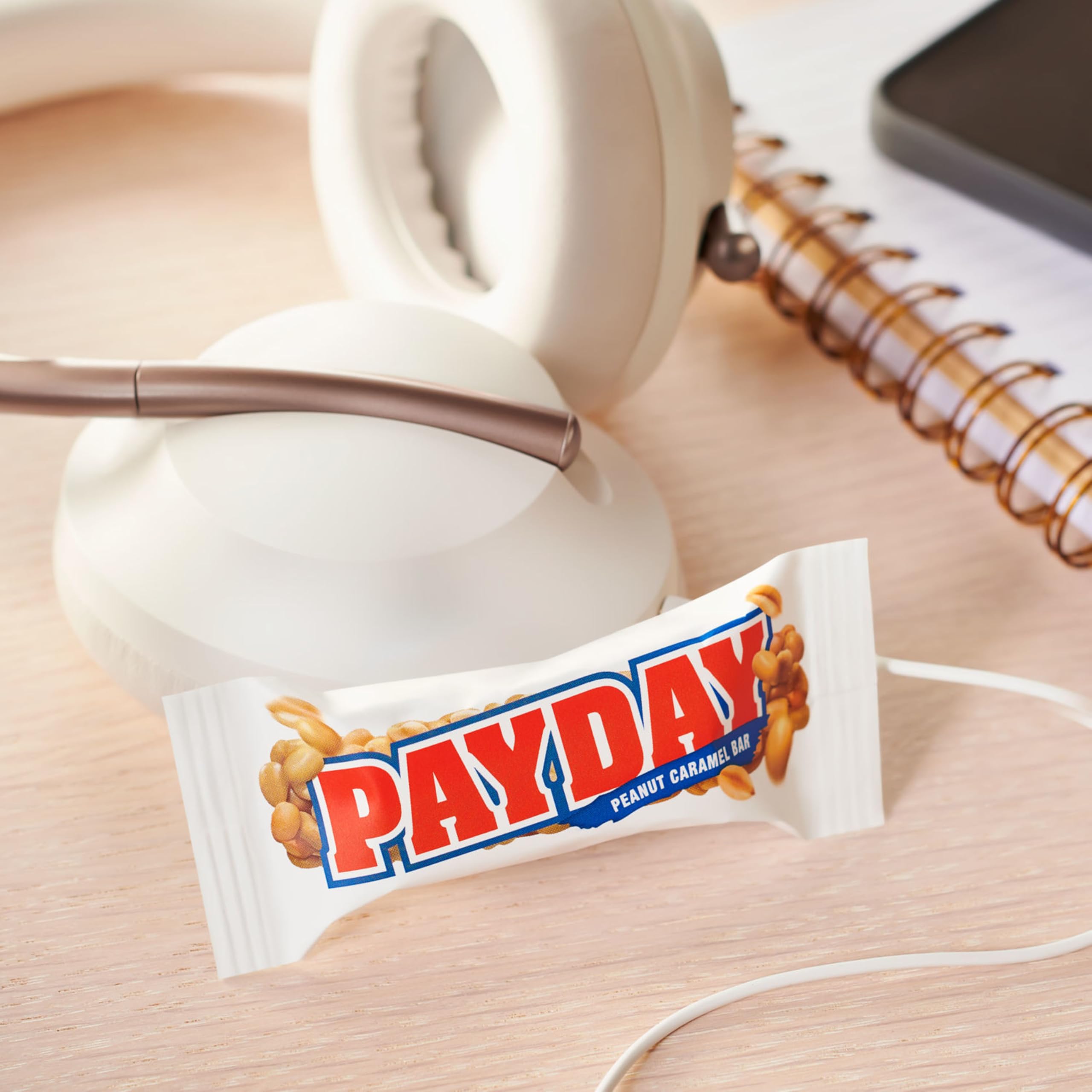 PAYDAY peanut caramel bars shared at a party moment for easy treats.