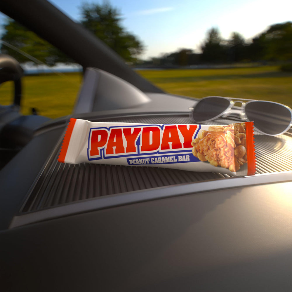 PAYDAY holiday gift display featuring 24 bars for celebrations.