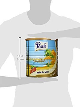 Peak Dry Whole Milk Powder poured into glass; rich, delicious drinking experience.