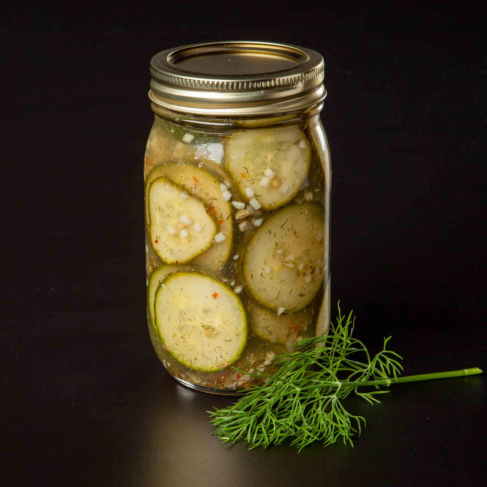 Finished dill pickles in a jar ready for sharing with Pearl and Johnny.