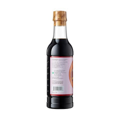 Pouring Pearl River Bridge dark soy sauce to enrich pan sauces