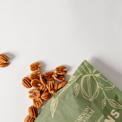 Close-up of Pearson Farm Elliot Pecans showcasing rich flavor and high oil content for baking or snacking.