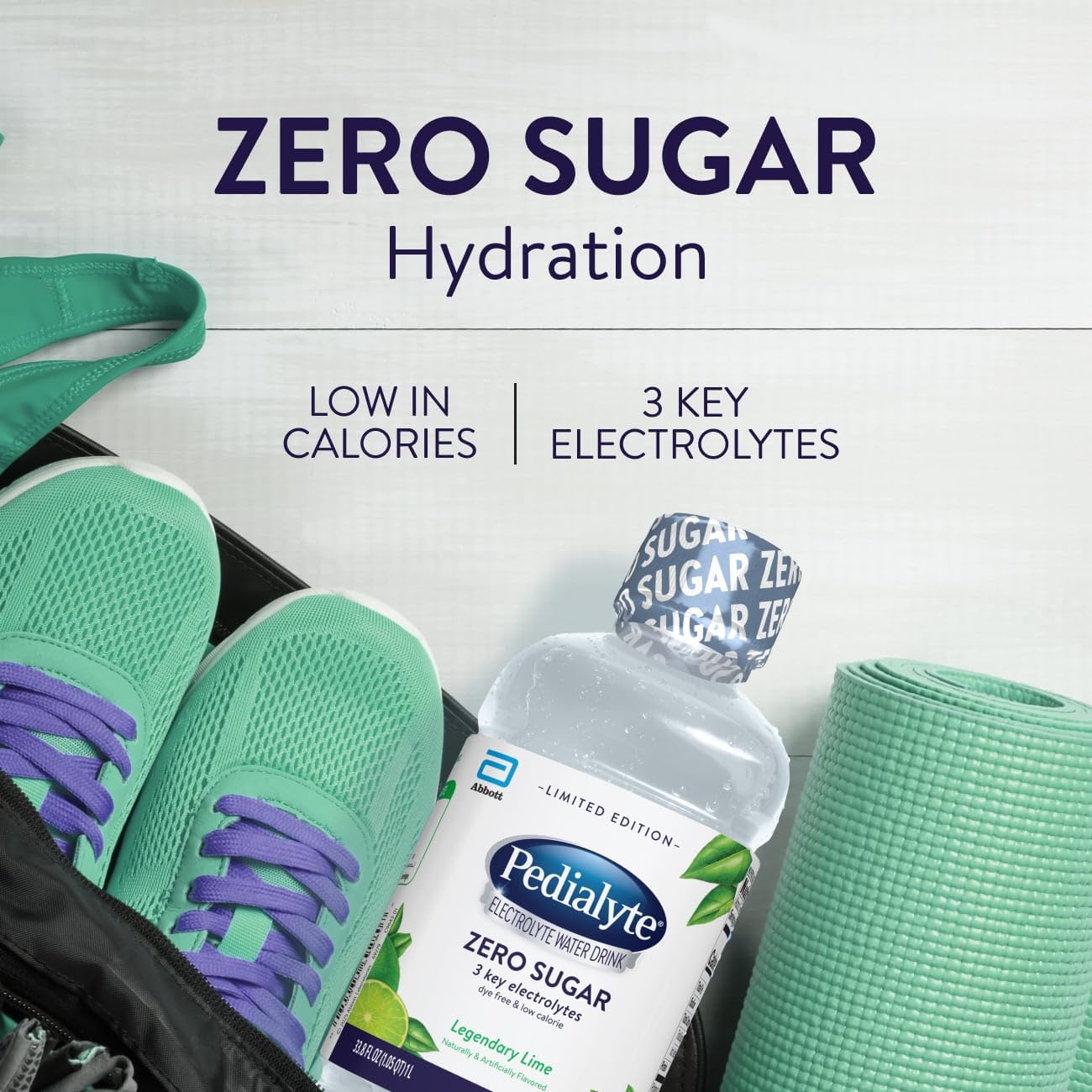 Pedialyte Legendary Lime glass beside the bottle illustrating low-calorie hydration.