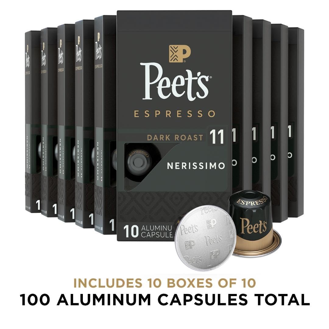 Closeup of aluminum Nerissimo capsules preserving rich aroma for intense espresso.