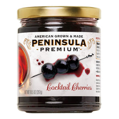 Peninsula Premium Cocktail Cherries in a glass, showcasing award-winning flavor for cocktails.