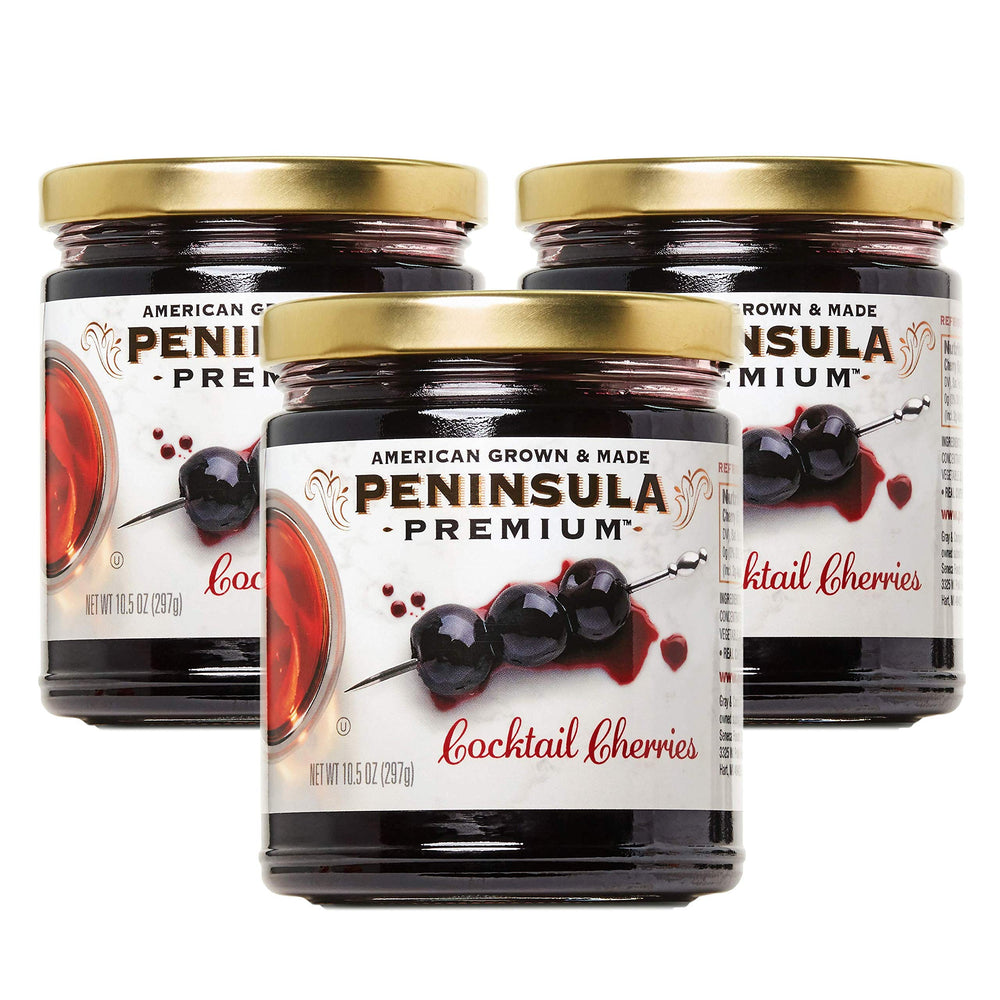 Peninsula Premium Cocktail Cherries bottle pour highlights rich cherry flavor and silky syrup.