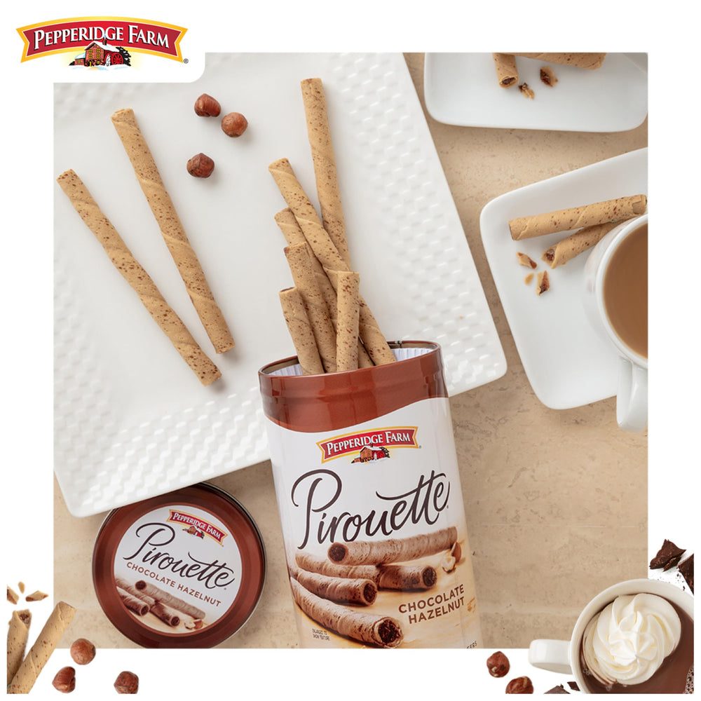 Pirouette wafers garnish a cupcake for an elegant dessert detail