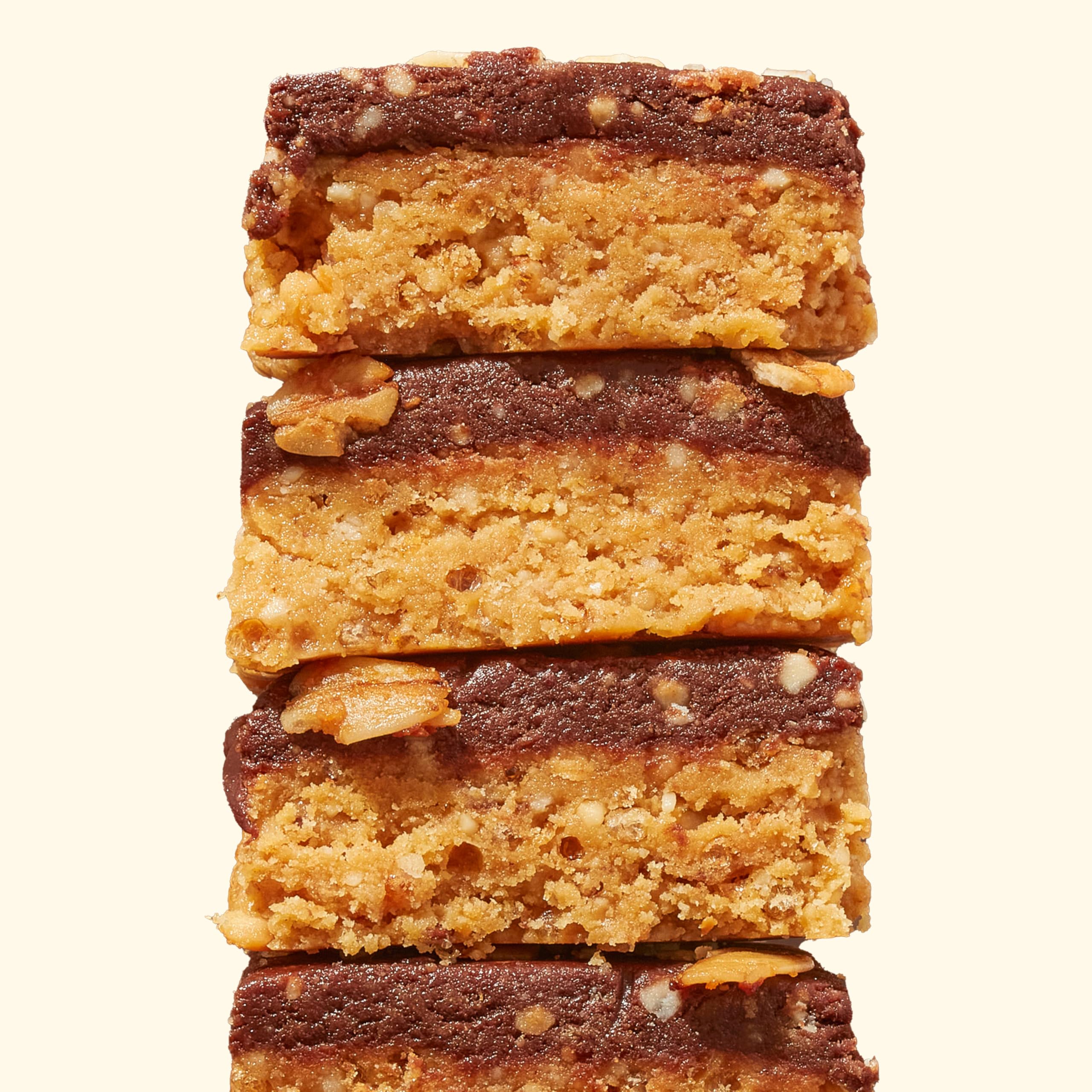 Cross-section highlights cashew butter, organic peanut butter, and dark chocolate topping.