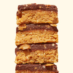 Cross-section highlights cashew butter, organic peanut butter, and dark chocolate topping.