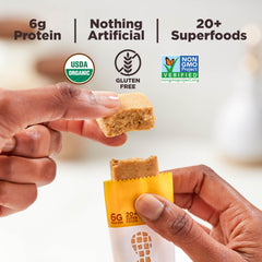 Organic peanut butter and honey visible in the bar's filling.