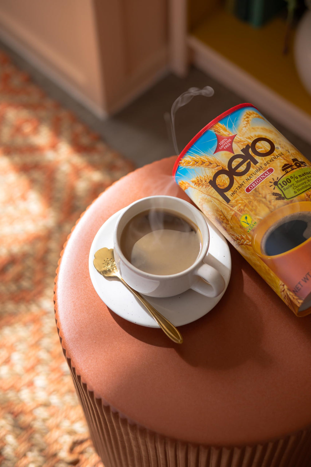 Pero instant natural beverage being poured into a mug for a warm, coffee-like cup without caffeine