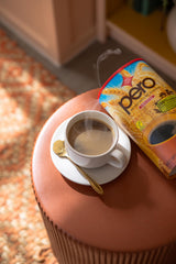 Pero instant natural beverage being poured into a mug for a warm, coffee-like cup without caffeine