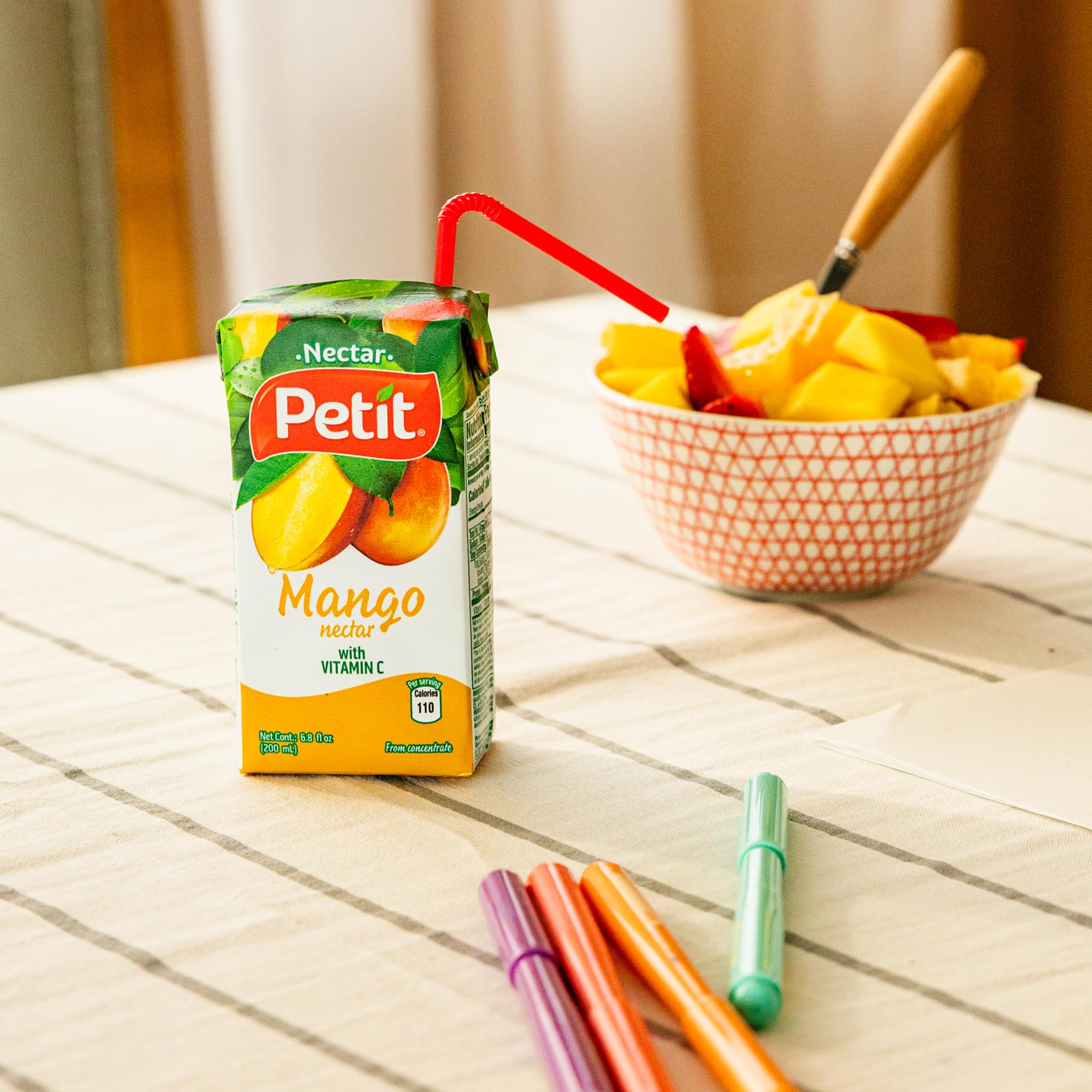 Petit Mango Nectar recyclable packaging emphasizing eco-friendly packs.