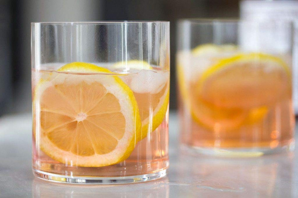 PEYCHAUD'S Aromatic Bitters served with cocktails, highlighting versatility.