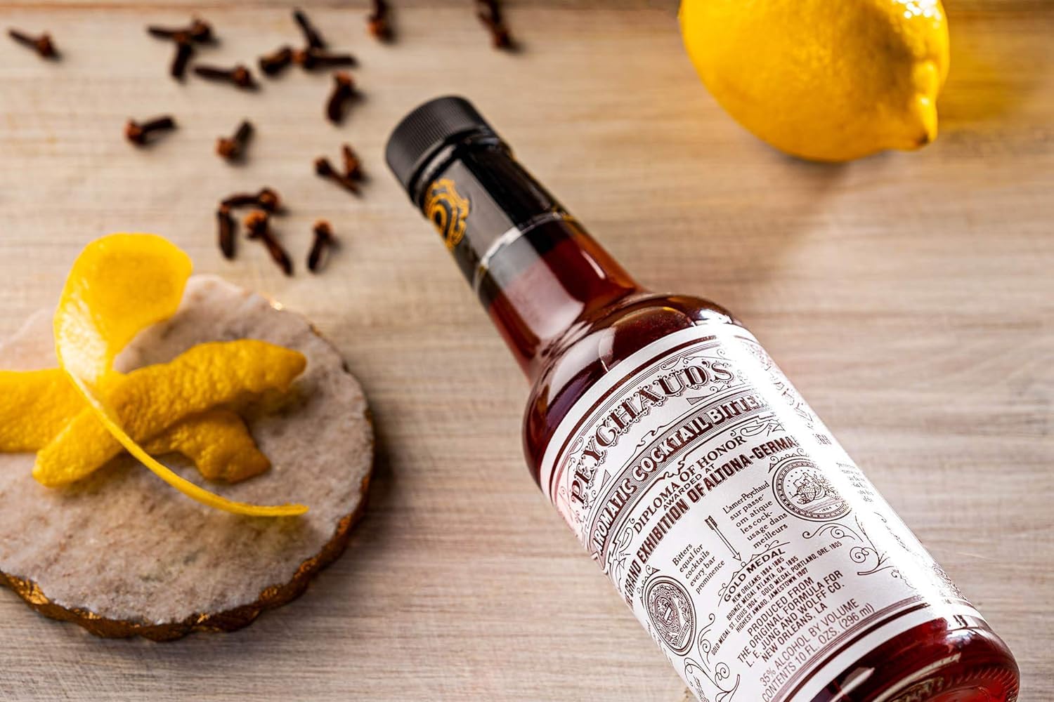 PEYCHAUD'S bottle pour shows even aroma release for balanced drinks