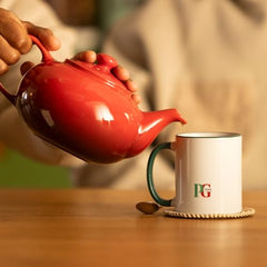 PG Tips loose-leaf tea packaging shows England origin and bulk value.