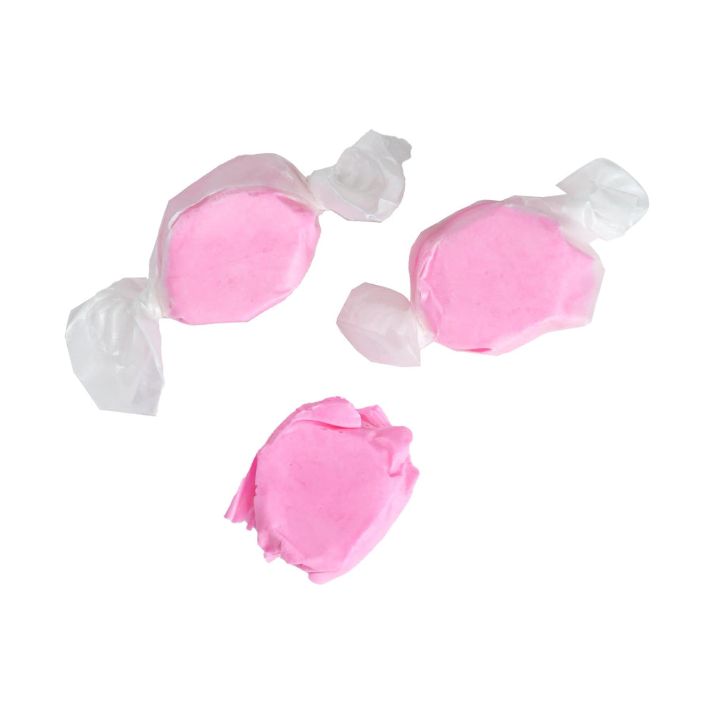 Pink strawberry taffy on a serving platter for gatherings.