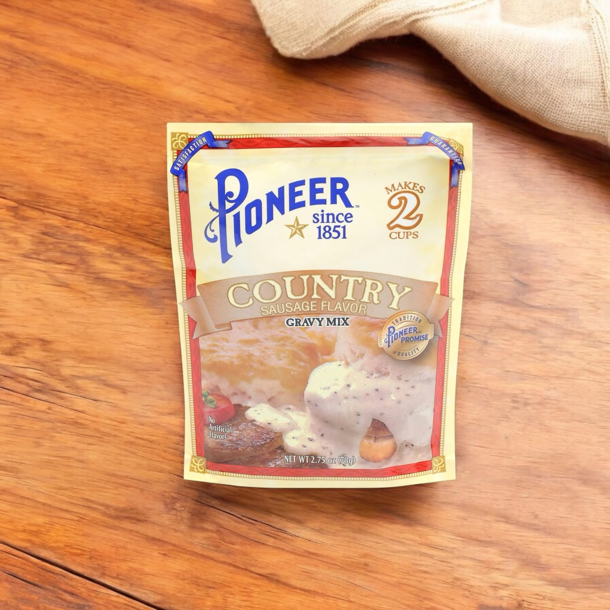 Serving Pioneer Country Sausage Gravy over mashed potatoes at breakfast.