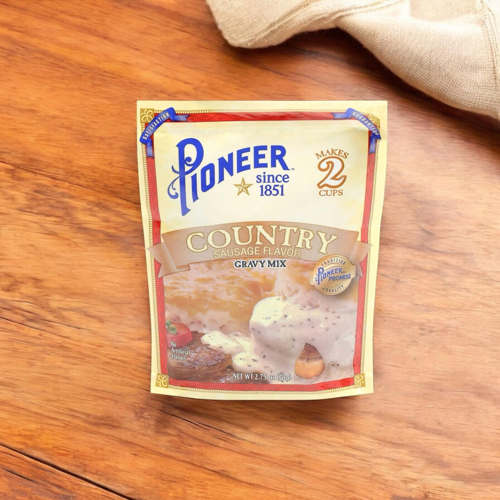 Serving Pioneer Country Sausage Gravy over mashed potatoes at breakfast.