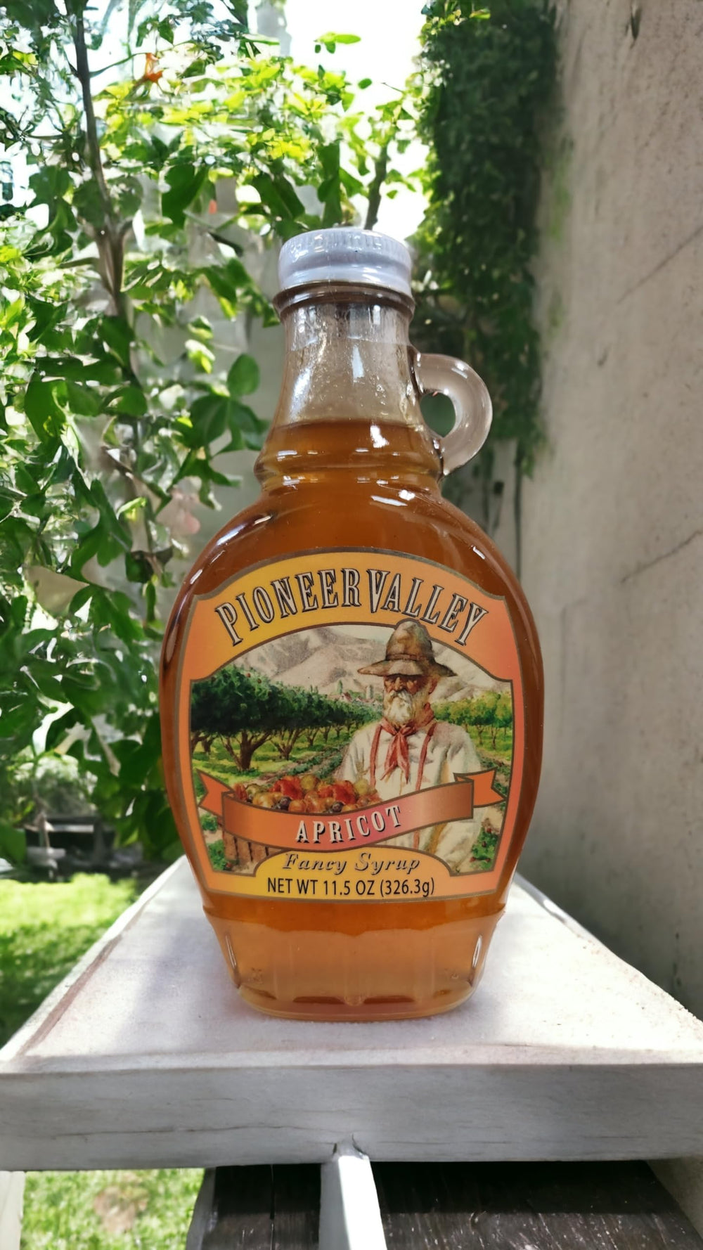 Pioneer Valley Apricot Pancake Syrup tasting at a cozy breakfast table.